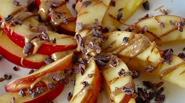 Pinwheel of Almond Butter Apple Slices on white pkate