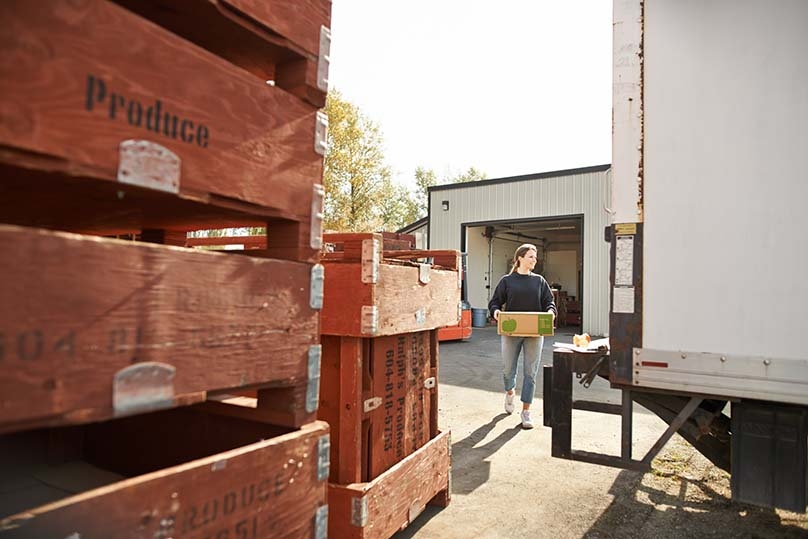 Fresh Local produce being loaded into a truck