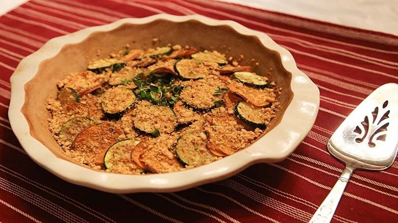 Zucchini & Sweet Potato Casserole, baking dish, serving utencil, placemat, wood table