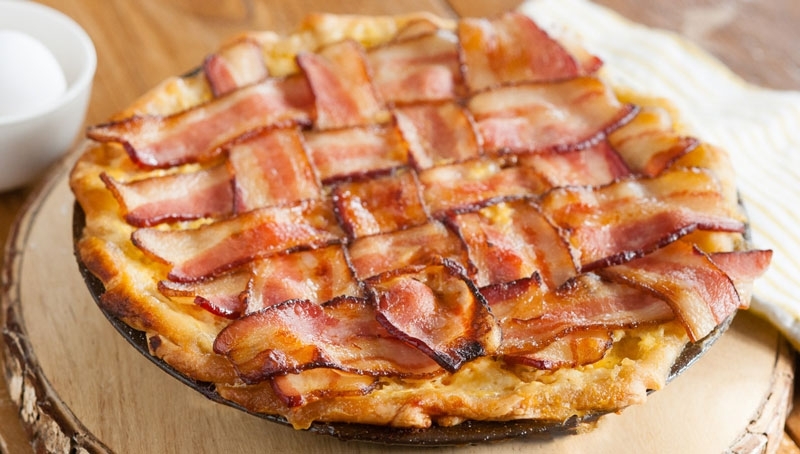 Savory bacon maple breakfast pie on wood table