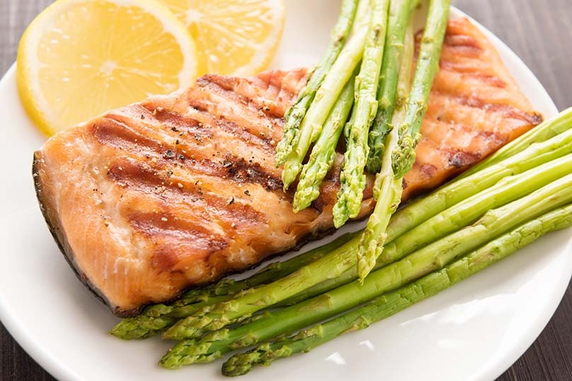 Grilling Seafood, grilled asparagus, lemon slices