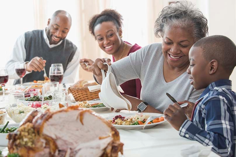 Family of Four Having a Thanksgiving Feast