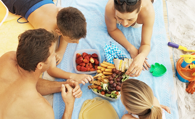 Elevated view of a family having a picnic at the beach