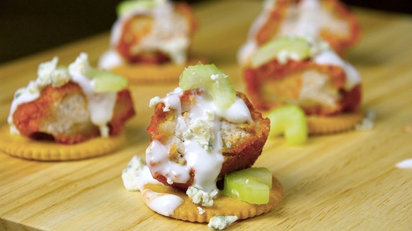 Kickin’ Buffalo Chicken Topped Crackers, wood table