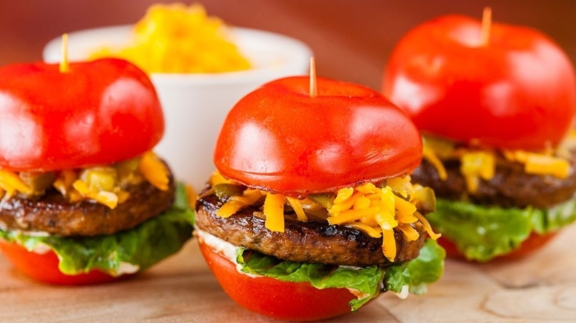 Tomato Bun Sliders, shredded cheese, wood table