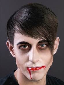 Man with vampire makeup painted on face